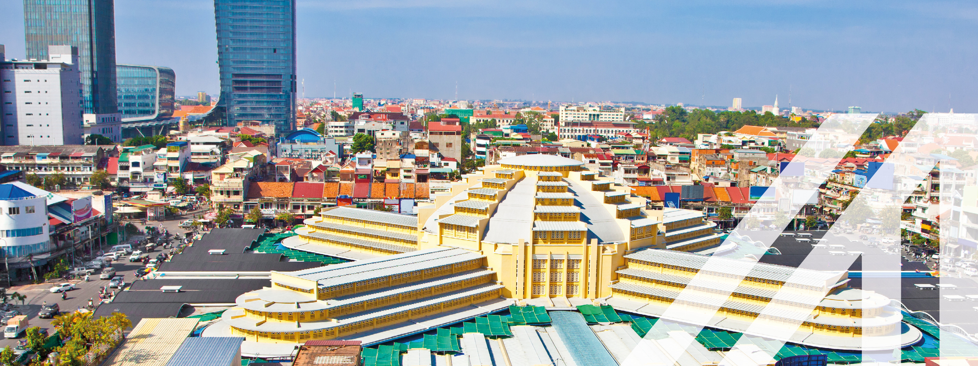 Moderne Architektur mit bunten Häusern im Vordergrund, moderne Wolkenkratzer im Hintergrund.