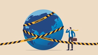 Erdkugel mit einer umringt mit einer Banderole mit der Aufschrift Saktionen 