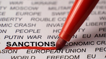 Ein roter Stift unterstreicht das Wort 