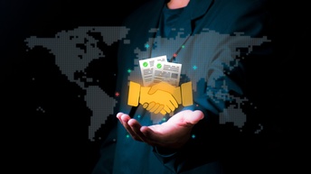 Internationale Verträge: Handschlag vor Weltkarte