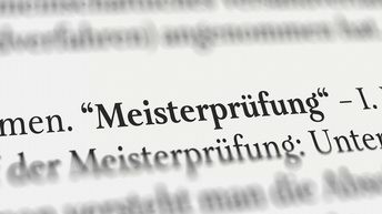 Nahaufnahme des gedruckten Wortes Meisterprüfung