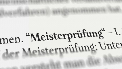 Nahaufnahme des gedruckten Wortes Meisterprüfung