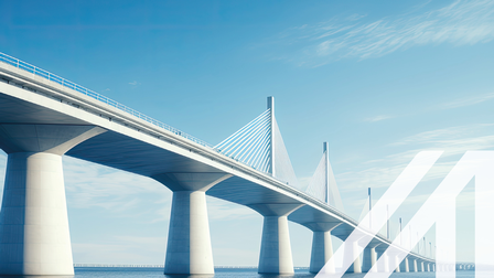 Bild einer modernen Brücke über das Meer, aufgenommen aus einem niedrigen Winkel mit blauem Himmel im Hintergrund.