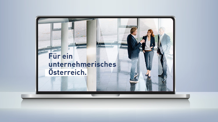 Laptop mit drei Personen und Text &bdquo;F&uuml;r ein unternehmerisches &Ouml;sterreich.&ldquo;