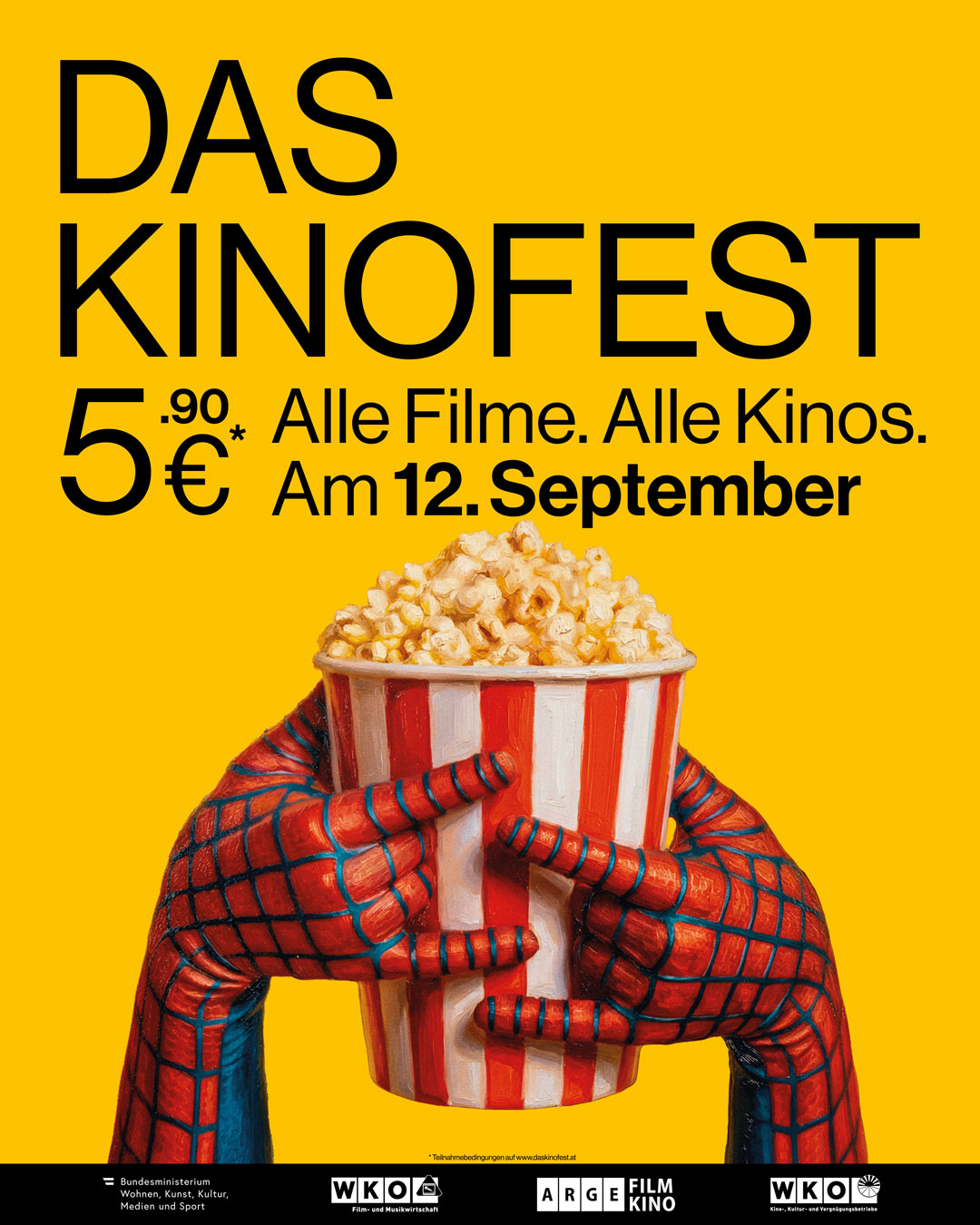Ein gro&szlig;es, rot-wei&szlig;es Popcornbeh&auml;ltnis, umgeben von roten, spinnennetz-&auml;hnlichen Armen und vor einem gelben Hintergrund.