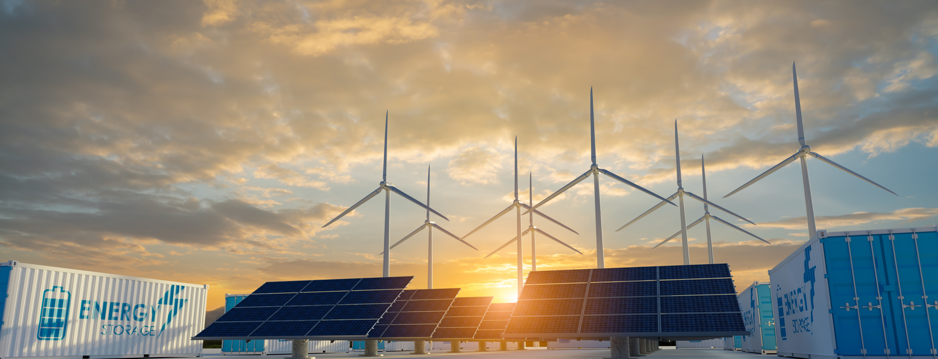 Solarpaneele, Windr&auml;der und Container mit der Aufschrift Energy storage im Sonnenuntergang