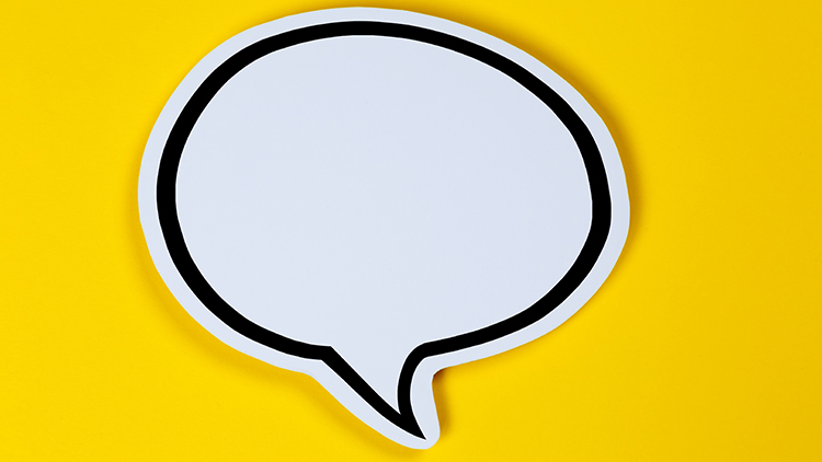 Wei&szlig;e Sprechblase mit schwarzer Umrandung auf gelbem Hintergrund